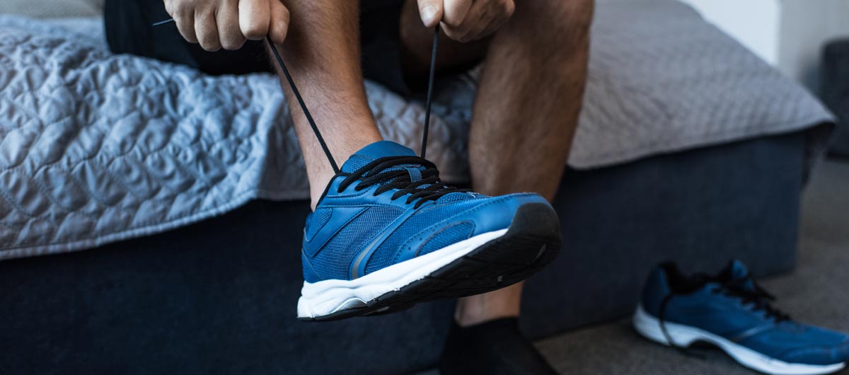 Man tying his sneakers