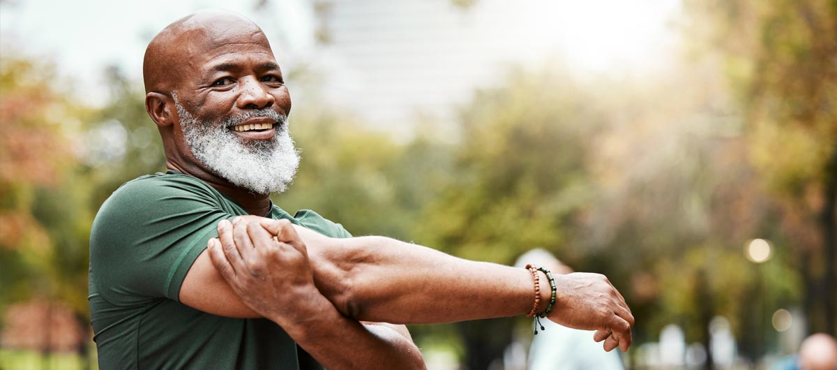 A man stretching his shoulder and tricep