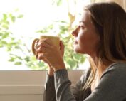 Woman looking out a window