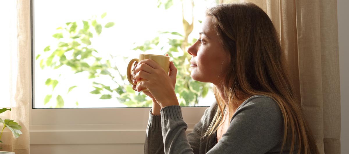 Woman looking out a window